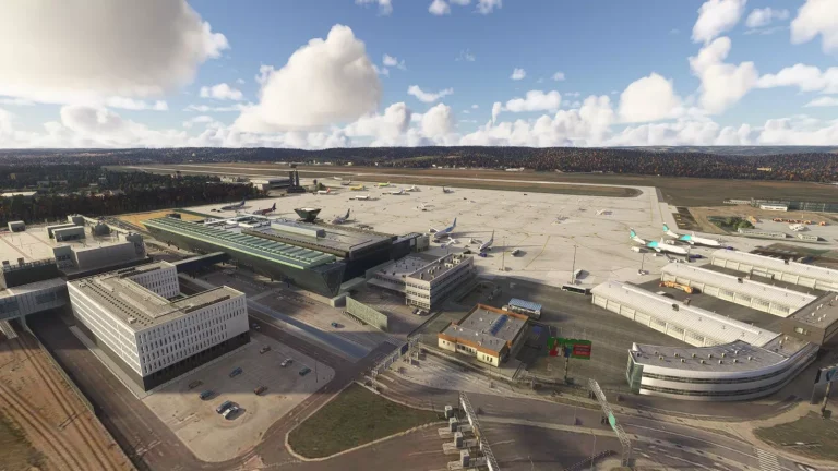 Daytime aerial overview of EPKK Krakow airport buildings and apron in Microsoft Flight Simulator 2024