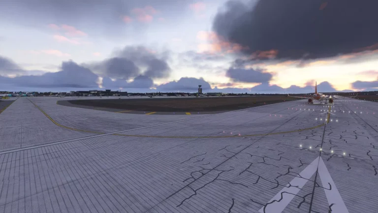 Wide view of EPKK Krakow airport apron and runway under cloudy sky in Microsoft Flight Simulator 2024