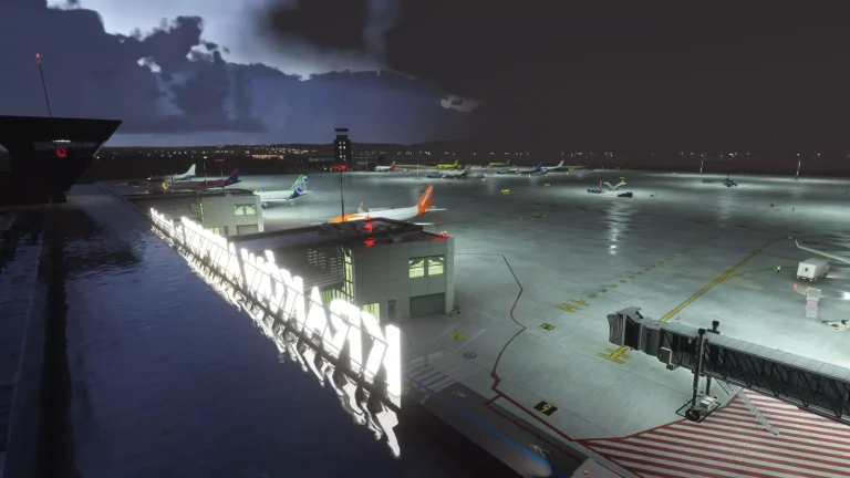 Illuminated Kraków Airport letters and apron at night seen from above in Microsoft Flight Simulator 2024