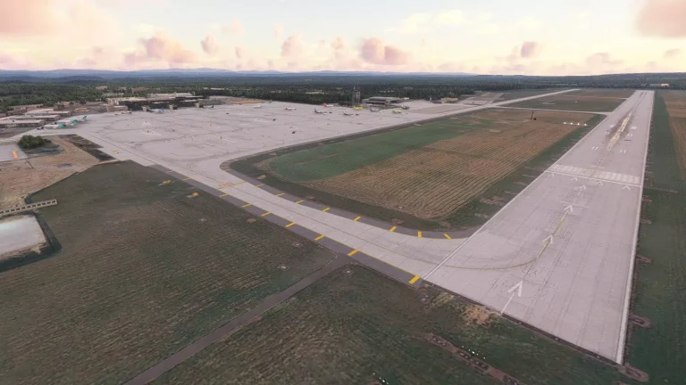 Aerial view of EPKK Krakow airport terminal and apron with parked aircraft in Microsoft Flight Simulator 2024